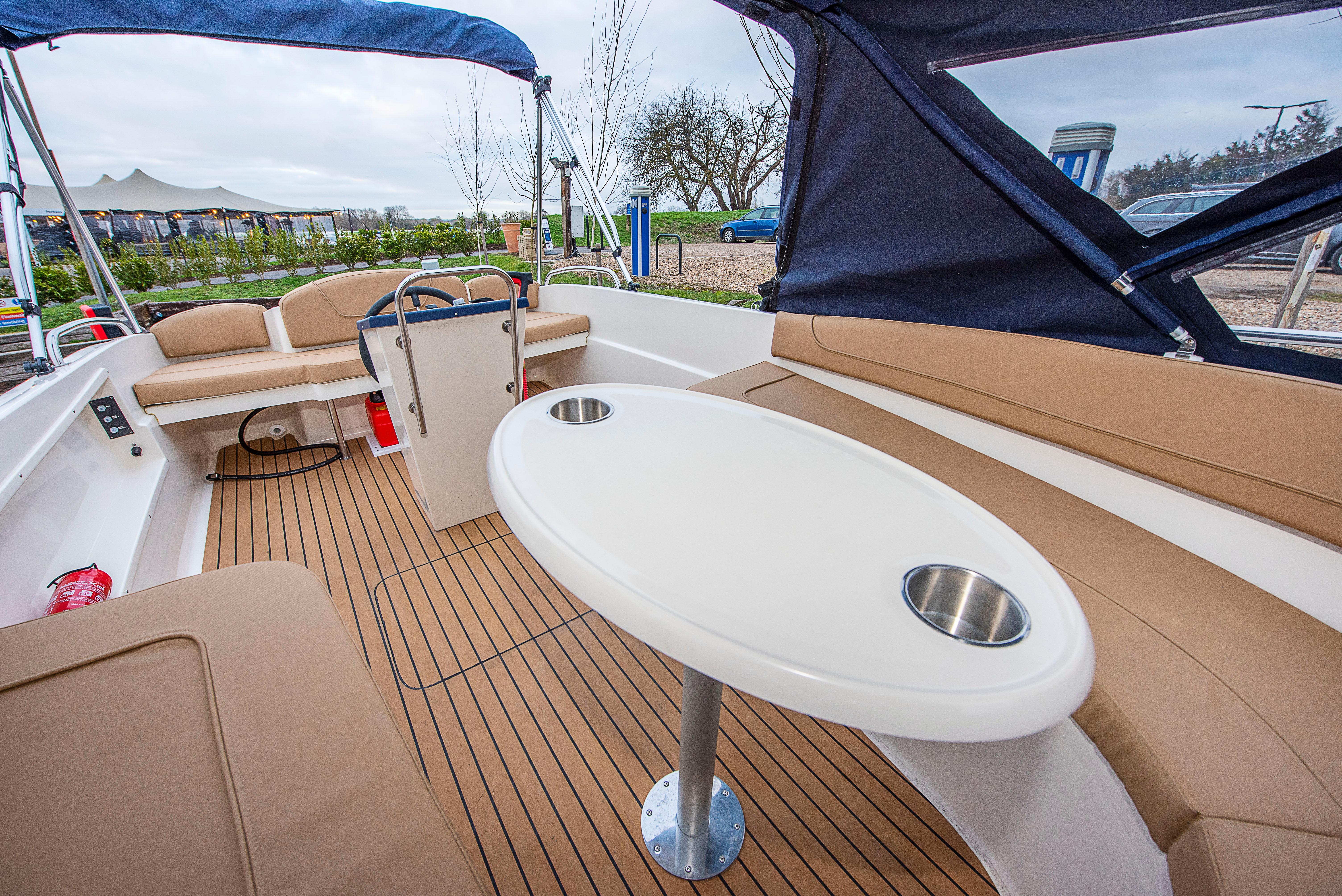 Comfortable Henley Five cockpit with a central table and spacious seating