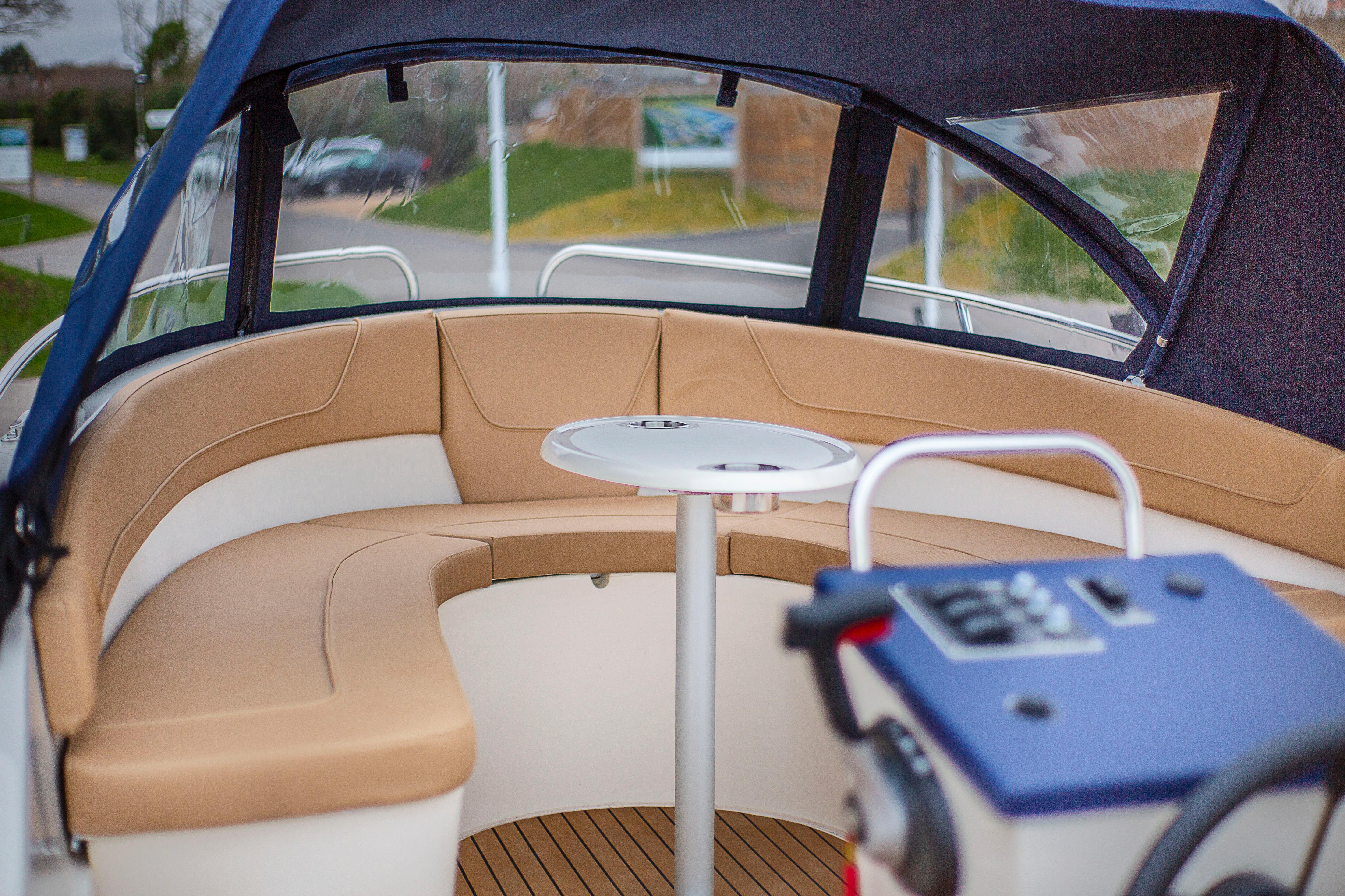 Henley Five upholstered seating and round cockpit table